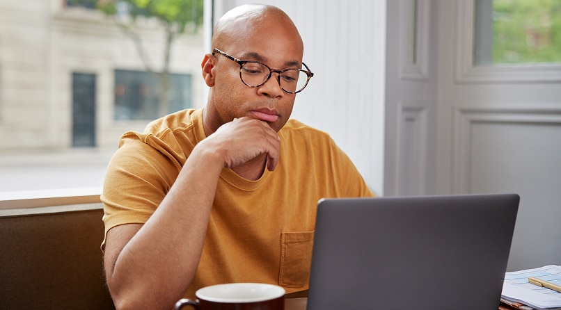A participant working on their laptop. 