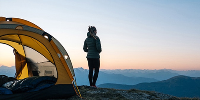Person camping looking out at the view